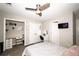 Bedroom featuring ceiling fan, closet workstations, and television at 1409 Echo Mill Dr, Powder Springs, GA 30127