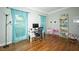 Sun-filled bedroom features hardwood floors, desk space, and charming decor at 1409 Echo Mill Dr, Powder Springs, GA 30127