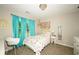 Charming bedroom with turquoise curtains and a decorative chandelier at 1409 Echo Mill Dr, Powder Springs, GA 30127