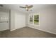 The bedroom includes a double door closet, carpeted floors and backyard views at 1409 Echo Mill Dr, Powder Springs, GA 30127