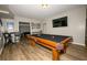 This game room is spacious with light walls and waterproof flooring at 1409 Echo Mill Dr, Powder Springs, GA 30127
