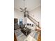 Bright living room features staircase, hardwood floors, ceiling fan, and modern furniture at 1409 Echo Mill Dr, Powder Springs, GA 30127
