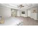 Large primary bedroom with ceiling fan, sitting area, and a television at 1409 Echo Mill Dr, Powder Springs, GA 30127