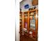 Well-organized walk-in pantry with custom wood shelving, storage and hardwood floors at 1409 Echo Mill Dr, Powder Springs, GA 30127