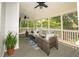 Cozy screened-in patio featuring comfortable seating and ceiling fans at 1409 Echo Mill Dr, Powder Springs, GA 30127