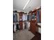 This walk-in closet has custom shelving for optimal storage at 1409 Echo Mill Dr, Powder Springs, GA 30127