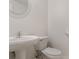 Simple half bathroom featuring a pedestal sink and toilet at 2594 Laurel Nw Cir, Atlanta, GA 30311