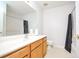 Clean bathroom featuring a wood vanity with ample counter space, a large mirror, and a shower-tub combination at 2594 Laurel Nw Cir, Atlanta, GA 30311