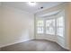 Bright bedroom featuring a bay window with abundant natural light and neutral floors at 2594 Laurel Nw Cir, Atlanta, GA 30311