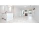 Open-concept living area with fireplace, view of kitchen, and lots of natural light at 2594 Laurel Nw Cir, Atlanta, GA 30311