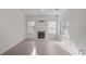 Inviting living room with fireplace and large windows providing natural light at 2594 Laurel Nw Cir, Atlanta, GA 30311