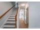 Bright entryway featuring a staircase with wood railing and neutral flooring at 2594 Laurel Nw Cir, Atlanta, GA 30311