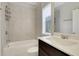 Bright bathroom featuring a tiled shower and a modern vanity at 3005 Devoncroft Se St, Smyrna, GA 30080