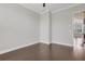 Neutral bedroom featuring hardwood floors and an adjoining area featuring window with blinds at 3005 Devoncroft Se St, Smyrna, GA 30080