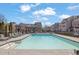 Relaxing community pool surrounded by lounge chairs, perfect for summer days at 3005 Devoncroft Se St, Smyrna, GA 30080