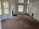 Living room featuring carpet, a fireplace, and a view of the front entry at 4232 Marjorie Rd, Snellville, GA 30039