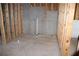 Unfinished basement area featuring concrete floor and exposed framing for future customization at 150 Canal St, Hampton, GA 30228