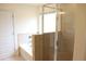 Bathroom featuring tub shower combo with glass doors and tile surround at 150 Canal St, Hampton, GA 30228