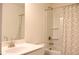 Bathroom featuring white vanity, bathtub with shower, and neutral shower curtain at 150 Canal St, Hampton, GA 30228