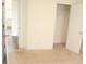 Bedroom with door to closet and wood flooring in the hall beyond at 150 Canal St, Hampton, GA 30228