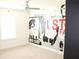 Bedroom with window and ceiling fan showcasing stylish wall art design at 150 Canal St, Hampton, GA 30228