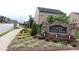 The Gates at Pates Creek entrance sign shows a brick and stone construction with decorative landscaping at 150 Canal St, Hampton, GA 30228