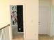 Hallway showing door, with rail and spindle railing and access to other rooms at 150 Canal St, Hampton, GA 30228
