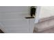 Hallway featuring a door with a black modern door handle, leading up carpeted stairs at 150 Canal St, Hampton, GA 30228