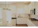 Well-appointed kitchen featuring granite counters, stainless appliances, and modern fixtures at 150 Canal St, Hampton, GA 30228