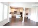 Spacious living room with an open floor plan leading to a modern kitchen at 150 Canal St, Hampton, GA 30228