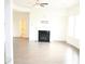 Bright living room featuring a fireplace, large windows and neutral paint at 150 Canal St, Hampton, GA 30228