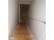 Staircase leading down to a lower level, featuring white walls and railing at 150 Canal St, Hampton, GA 30228