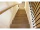 Wooden stairs with white trim and black metal spindles lead to the next floor at 150 Canal St, Hampton, GA 30228