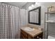 Bathroom with a black framed mirror and a shower curtain at 1500 Pine Log #D Ne Rd, Conyers, GA 30012