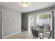 Bright dining area with a glass table and sliding glass doors at 1500 Pine Log #D Ne Rd, Conyers, GA 30012