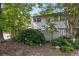 Charming two-story home featuring a well-manicured front yard and a white picket fence at 1500 Pine Log #D Ne Rd, Conyers, GA 30012