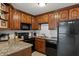 Well-equipped kitchen with granite countertops and black appliances at 1500 Pine Log #D Ne Rd, Conyers, GA 30012