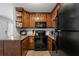 Cozy kitchen featuring wood cabinets, granite countertops, and appliances at 1500 Pine Log #D Ne Rd, Conyers, GA 30012