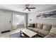 Bright living room featuring a comfortable sofa and a large window at 1500 Pine Log #D Ne Rd, Conyers, GA 30012