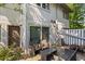 Exterior patio with comfortable wicker seating and a charming fenced yard at 1500 Pine Log #D Ne Rd, Conyers, GA 30012