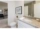 Elegant bathroom featuring granite countertops, a white sink, and stylish decor at 1577 Aiden Way # 39, Conyers, GA 30013