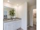 Bathroom featuring double sinks, granite countertops, and a walk-in shower for a spa-like experience at 1577 Aiden Way # 39, Conyers, GA 30013