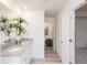 Bathroom with double sinks, granite counters, modern fixtures, and lots of natural light at 1577 Aiden Way # 39, Conyers, GA 30013