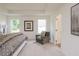 Bedroom with natural light, soft carpet, and calm, neutral colors creating a serene space at 1577 Aiden Way # 39, Conyers, GA 30013