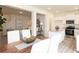 Stylish dining area connects kitchen and living space, featuring stainless steel appliances at 1577 Aiden Way # 39, Conyers, GA 30013