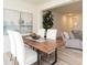 Modern dining area adjacent to living area, featuring luxury floors and decor at 1577 Aiden Way # 39, Conyers, GA 30013