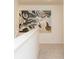 Bright hallway features modern art, neutral carpeting, and freshly painted white walls at 1577 Aiden Way # 39, Conyers, GA 30013