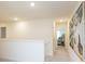 Upstairs hallway with carpet, white walls, a large painting, and doorways to bedrooms at 1577 Aiden Way # 39, Conyers, GA 30013