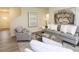 Cozy living room with staircase, modern decor, and open-plan to dining area at 1577 Aiden Way # 39, Conyers, GA 30013