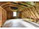 Unfinished attic featuring exposed wooden beams and framing, ready for customization at 1699 Emerald Sw Ave, Atlanta, GA 30310